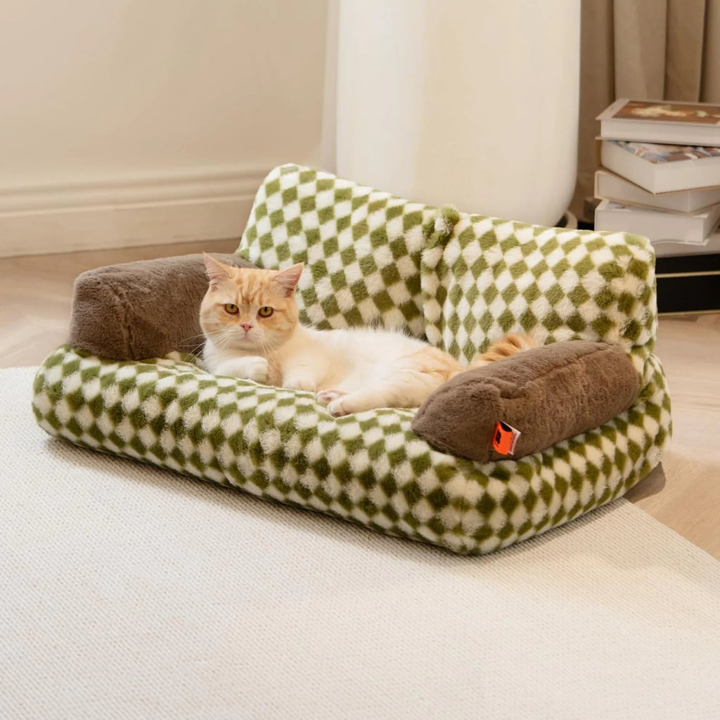 Cat relaxing on a stylish washable fluffy pet couch bed with non-slip features for maximum comfort and durability.