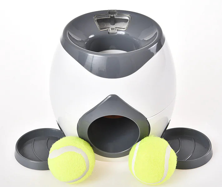 Interactive dog toy with ball feeder, featuring a tennis ball launcher and treat dispenser for stimulating play and reward.