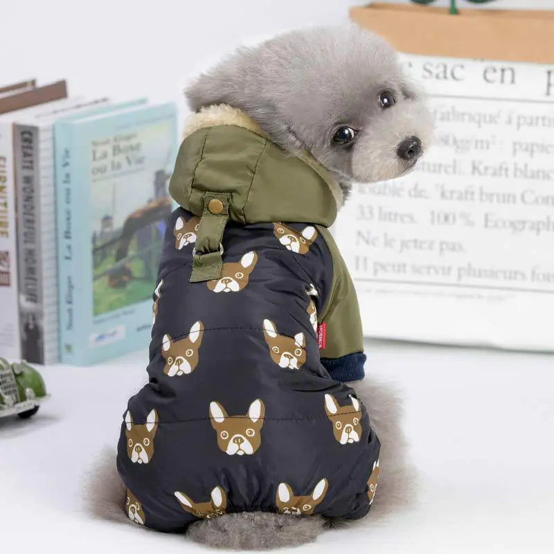 Small dog wearing comfortable dog clothing with a printed design and hood, perfect for keeping pets warm and stylish this winter.