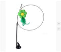 Interactive cat teaser toy with suction cup base and feathered flower attachment for feline entertainment.