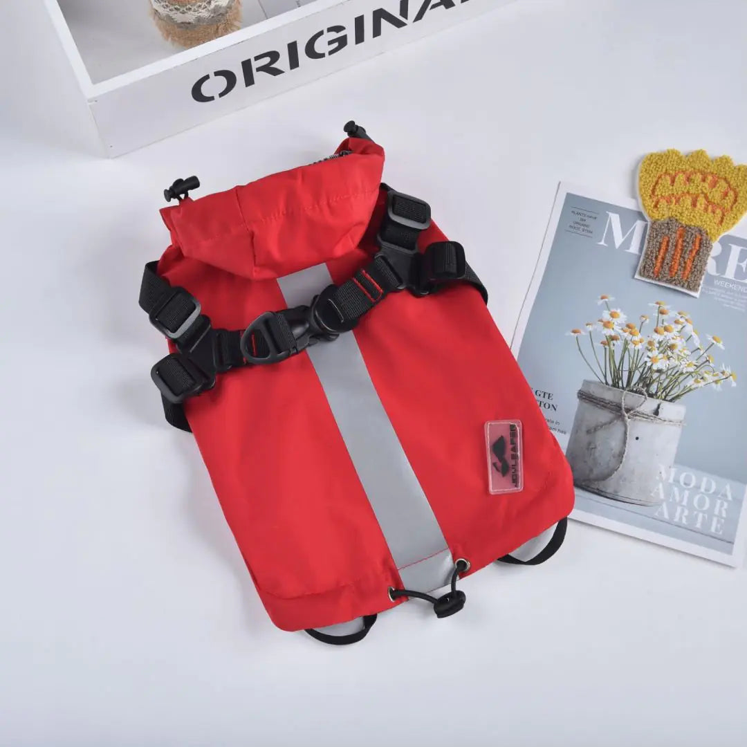 Red waterproof dog raincoat with reflective strip, ideal for pets in wet weather.