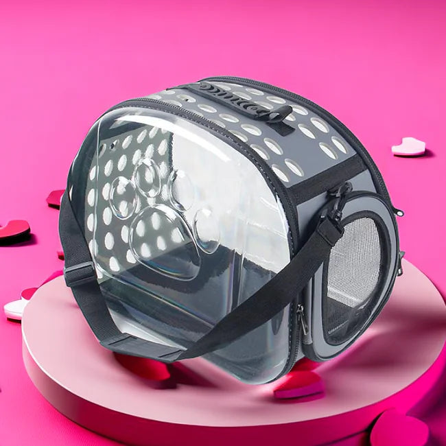 Foldable pet carrier bag for cats and dogs with clear PVC design on pink background