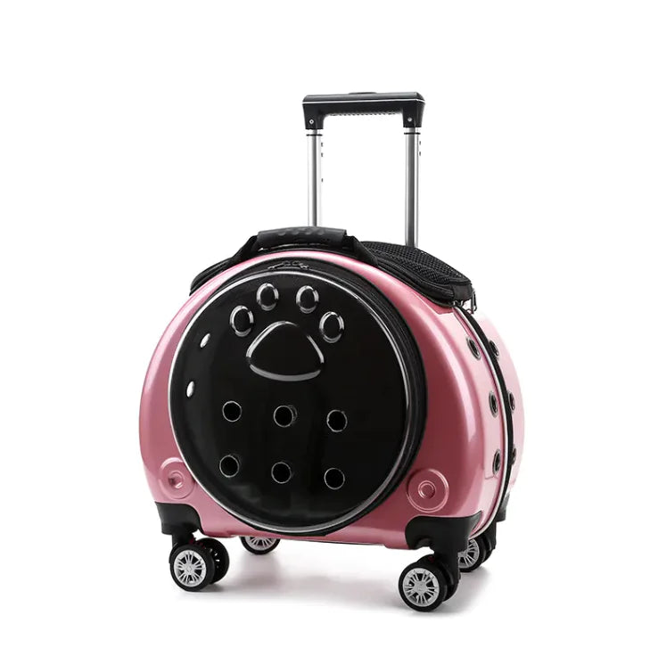 Compact pet travel bag in pink with geometric design and wheels for easy transport.