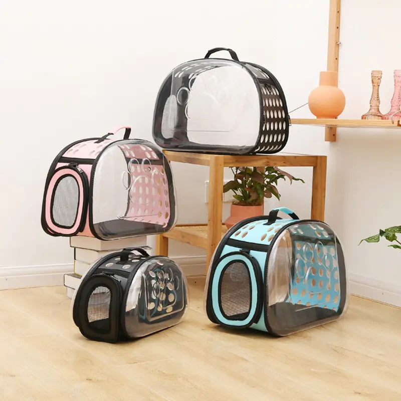 Various colors of foldable pet carrier bags for cats and dogs made from durable PVC, featuring a stylish space capsule design.