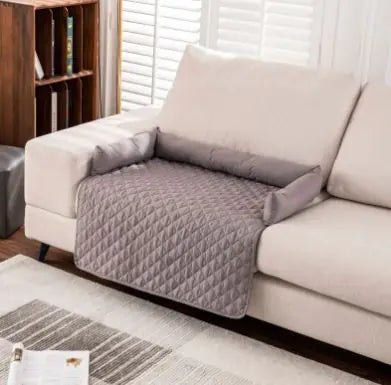 waterproof pet sofa mat on white couch, protecting furniture with quilted design, ideal for pets indoors and outdoors