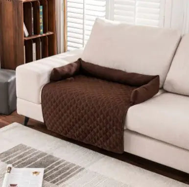 Brown waterproof pet sofa mat on white sofa in living room setting, showcasing its protective and comfortable features.