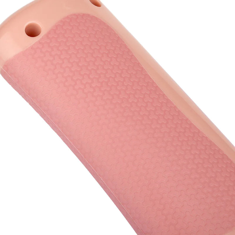 Close-up of versatile pet grooming comb handle with textured grip