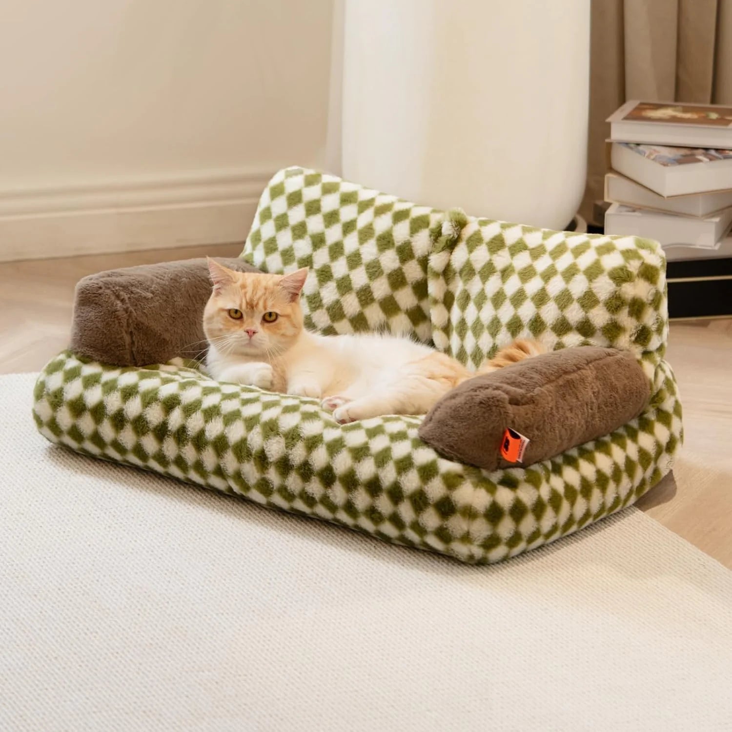 Cat lounging on a washable fluffy pet couch bed with checkered design, offering comfort and relaxation for cats and small dogs.