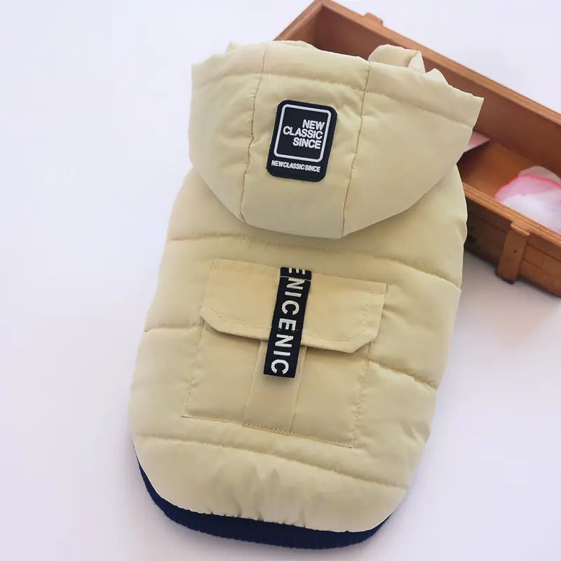 Chic winter dog vest in beige, stylish and warm, featuring a hood and pocket, made from high-quality polyester for durability.
