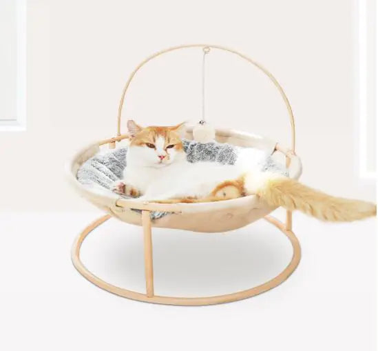 Cat lounging in a pink and off-white washable universal pet bed, 46cm, all-season comfort highlighted.