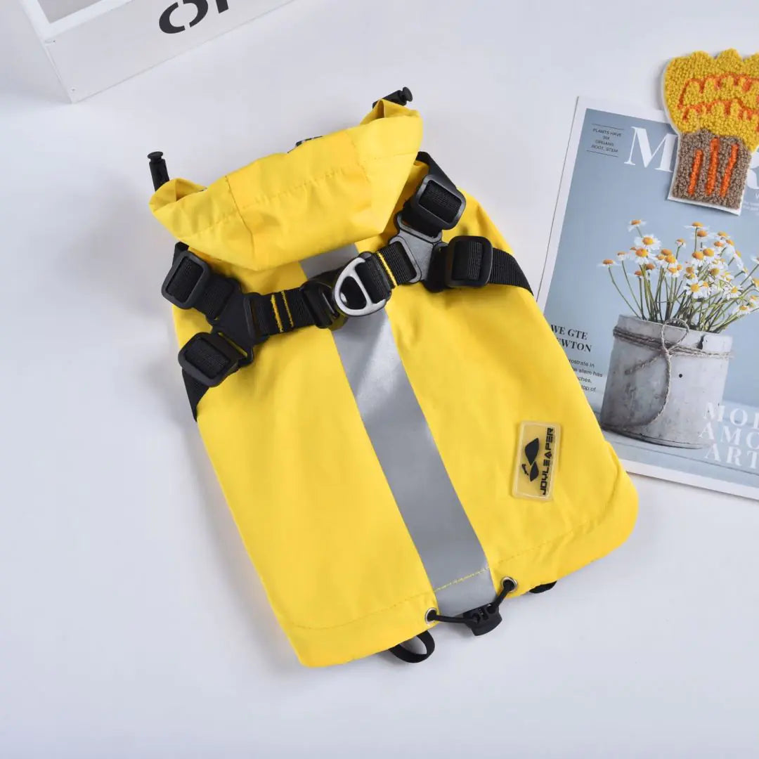 Yellow waterproof dog raincoat with reflective strip, harness attachments, and stylish design, perfect for keeping pets dry in all weather.