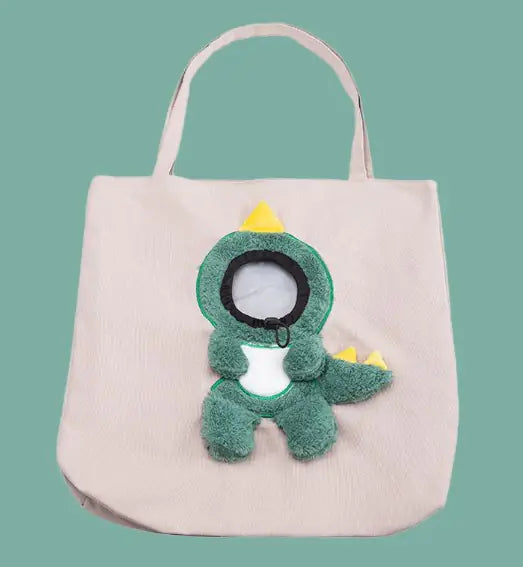 Beige plush bag with a dinosaur design, highlighting the playful style of pet accessories.