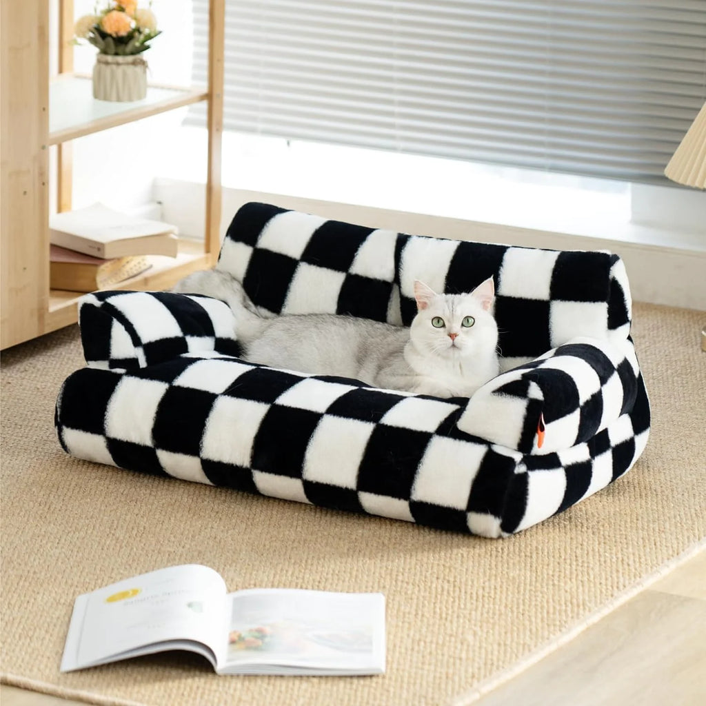 Cat lounging on a washable fluffy pet couch bed with black and white checkered design